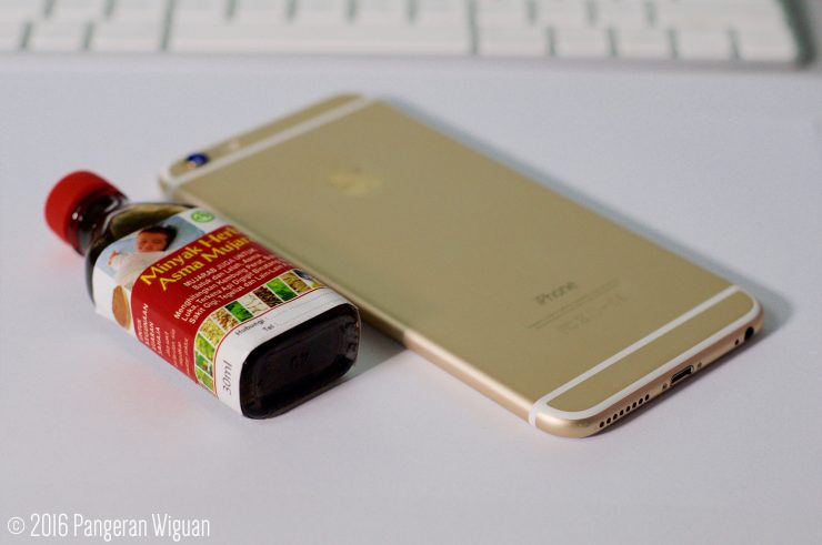 Minyak Herba Asma Mujarab Bottle Size Compared to iPhone 6 Plus